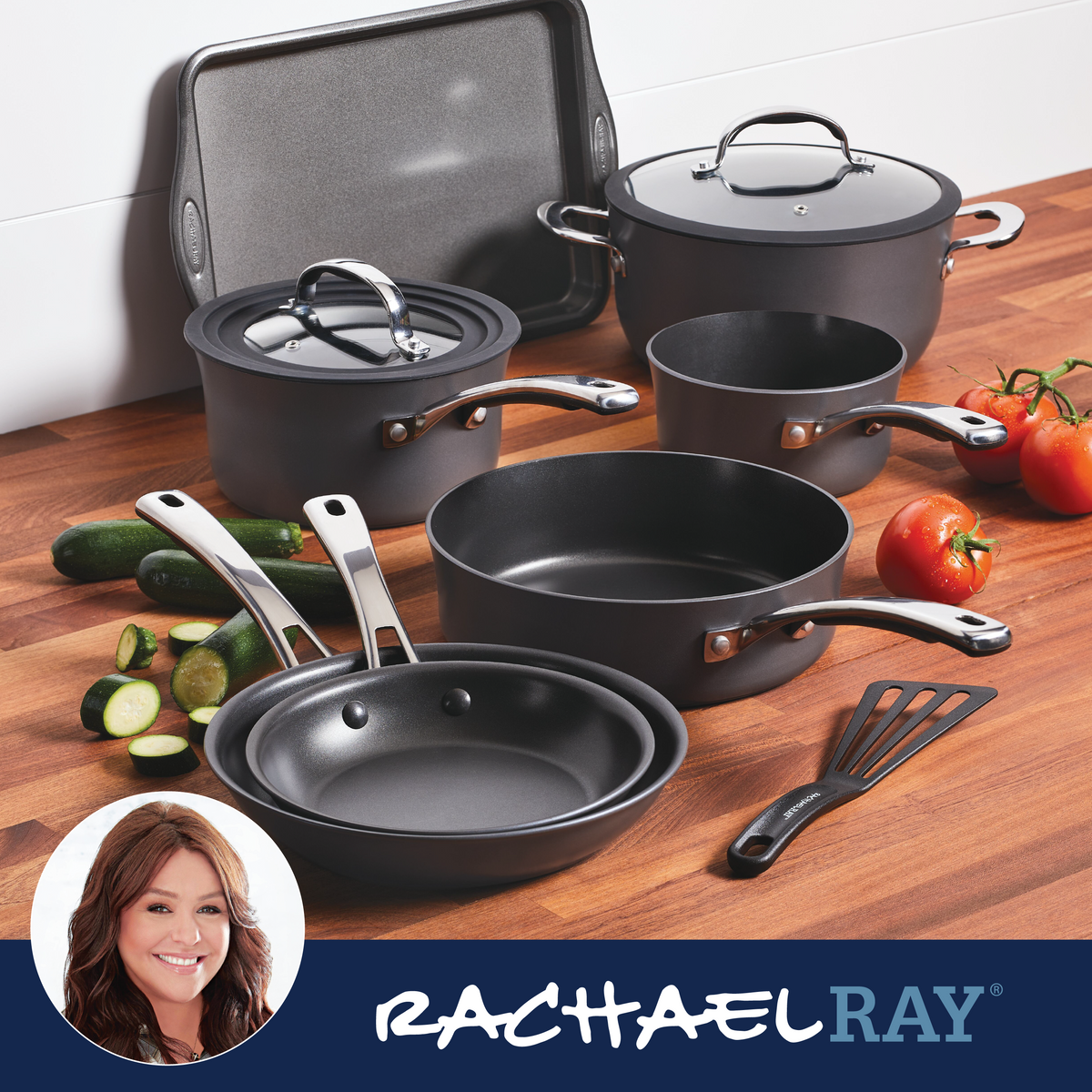 Cookware set with vegetables on a wooden counter, "Rachael Ray" branding.