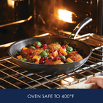 Skillet with vegetables and meat in oven, safe to 400°F.