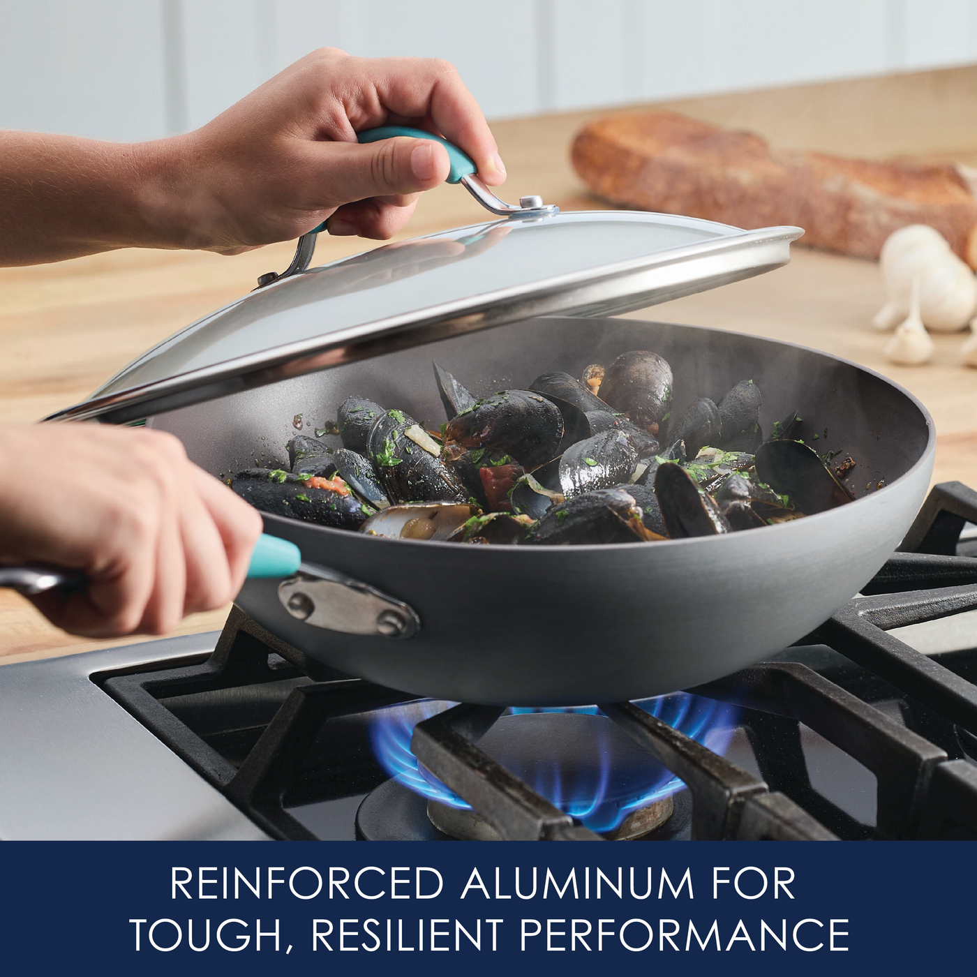 Cooking mussels in a pan on a gas stove with a lid being placed.