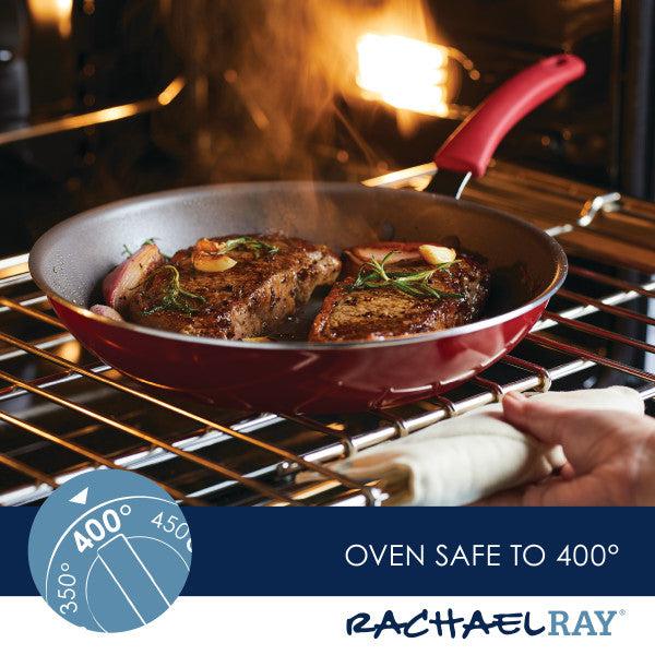 A succulent steak sizzles in a Cook + Create Nonstick Frying Pan inside an oven, which is labeled "Oven safe to 400°". Crafted with thicker gauge aluminum, the pan ensures even cooking and enhanced durability.