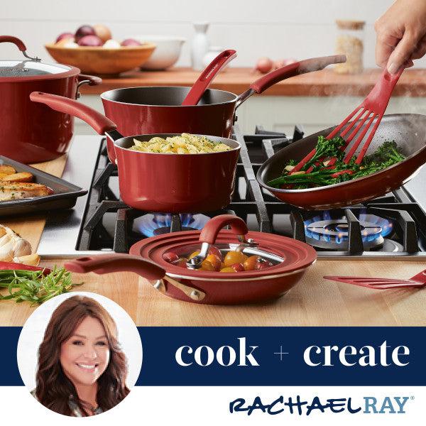 A high-performance red cookware set gleams on the stove, with vegetables and pasta cooking effortlessly in a Cook + Create Nonstick Frying Pan crafted from thicker gauge aluminum.