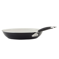 Ceramic Nonstick Frying Pan, black with white interior and black handle, side view.