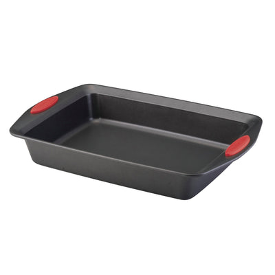 Rectangular non-stick baking pan with red silicone grips on the handles.