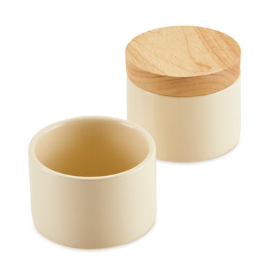 Two cream ceramic containers, one covered with a wooden lid.