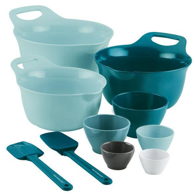 Set of blue and teal mixing bowls, measuring cups, and spatulas.