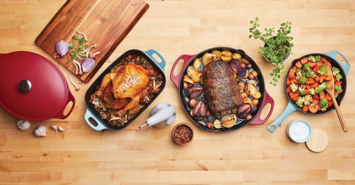 Cooked chicken, roast with vegetables, and stir fry on a wooden table.