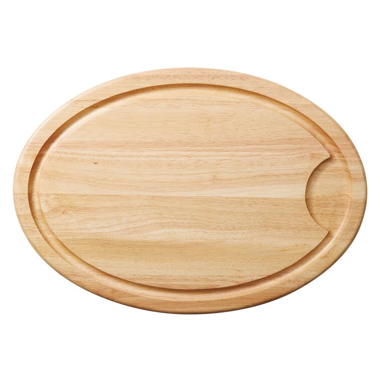 Oval wooden cutting board with a groove and a notch on one side.