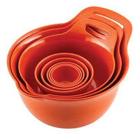Stacked orange measuring cups and bowls with handles.