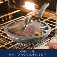 Frying pan with glass lid cooking in oven, labeled oven safe to 400°F.