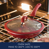 Red frying pan and lid in oven, marked as oven safe to specific temperatures.