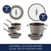 Cookware set with silicone-rimmed glass lids and pans of various sizes.