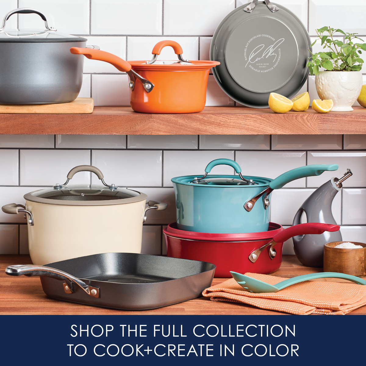 Colorful cookware displayed on wooden shelves in a kitchen setting.