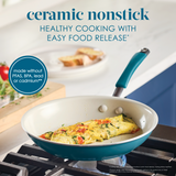 A ceramic nonstick pan with an omelet on a stove.