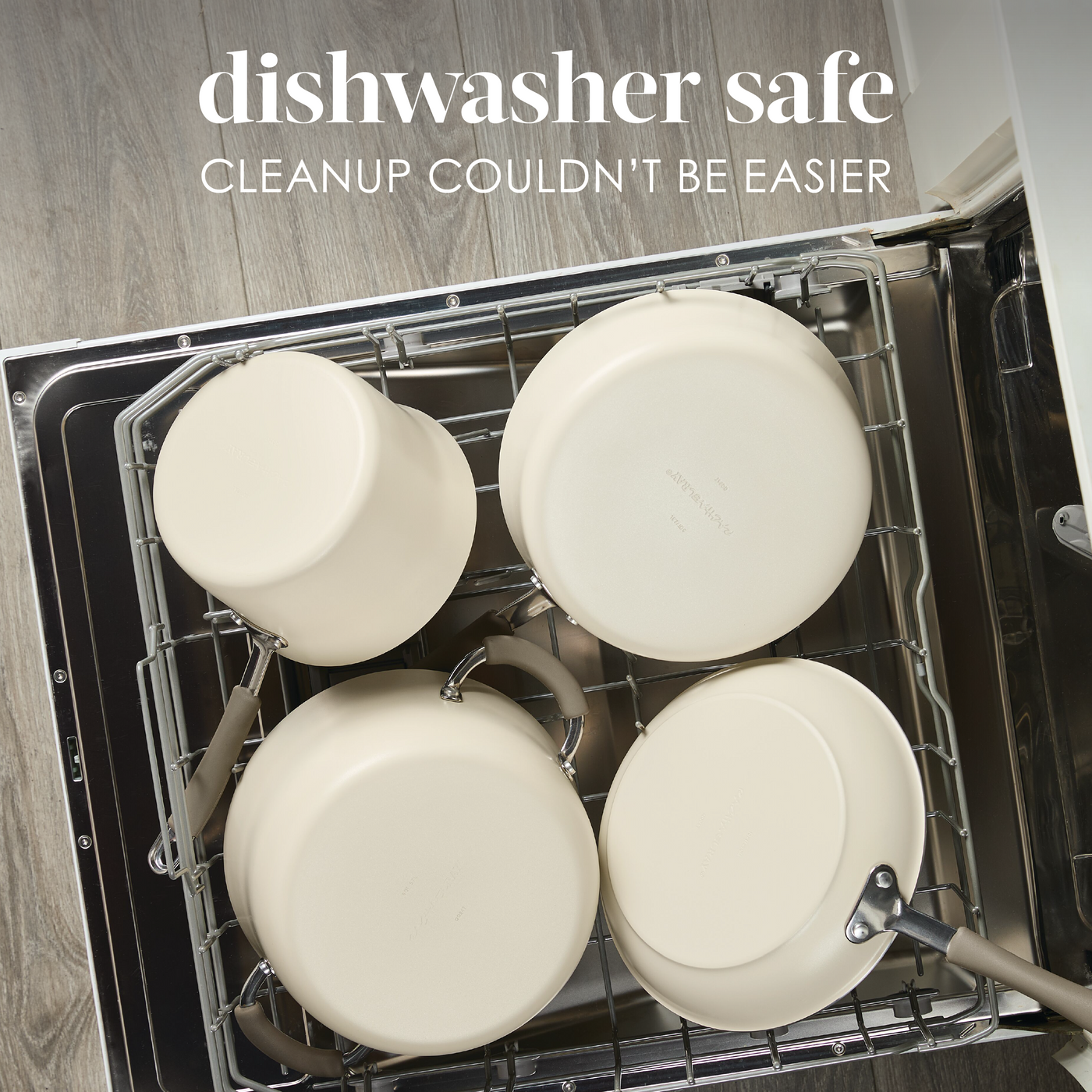Four cream-colored pots placed inside an open dishwasher.