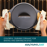 Person placing a ceramic dish into an oven on a rack.