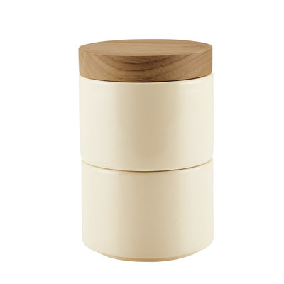 Cream ceramic container with a wooden lid.