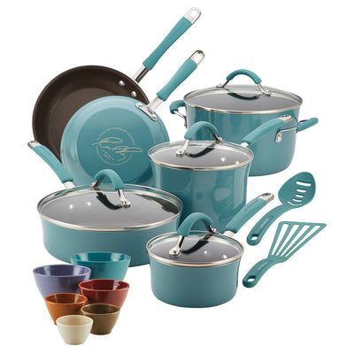 Teal cookware set with lids, pans, bowls, and utensils.