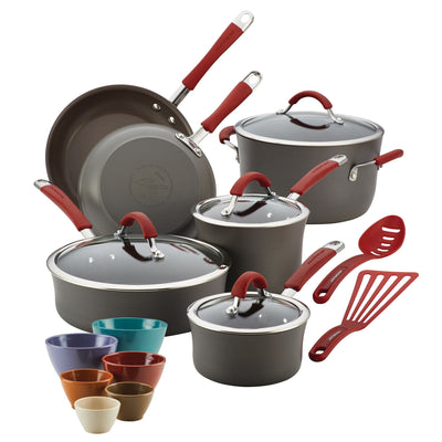 Cookware set with pots, pans, bowls, lids, and utensils in various colors.