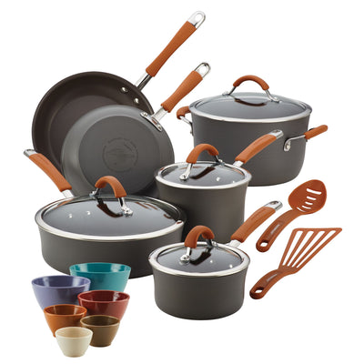 Assorted cookware set with pots, pans, lids, and measuring cups.