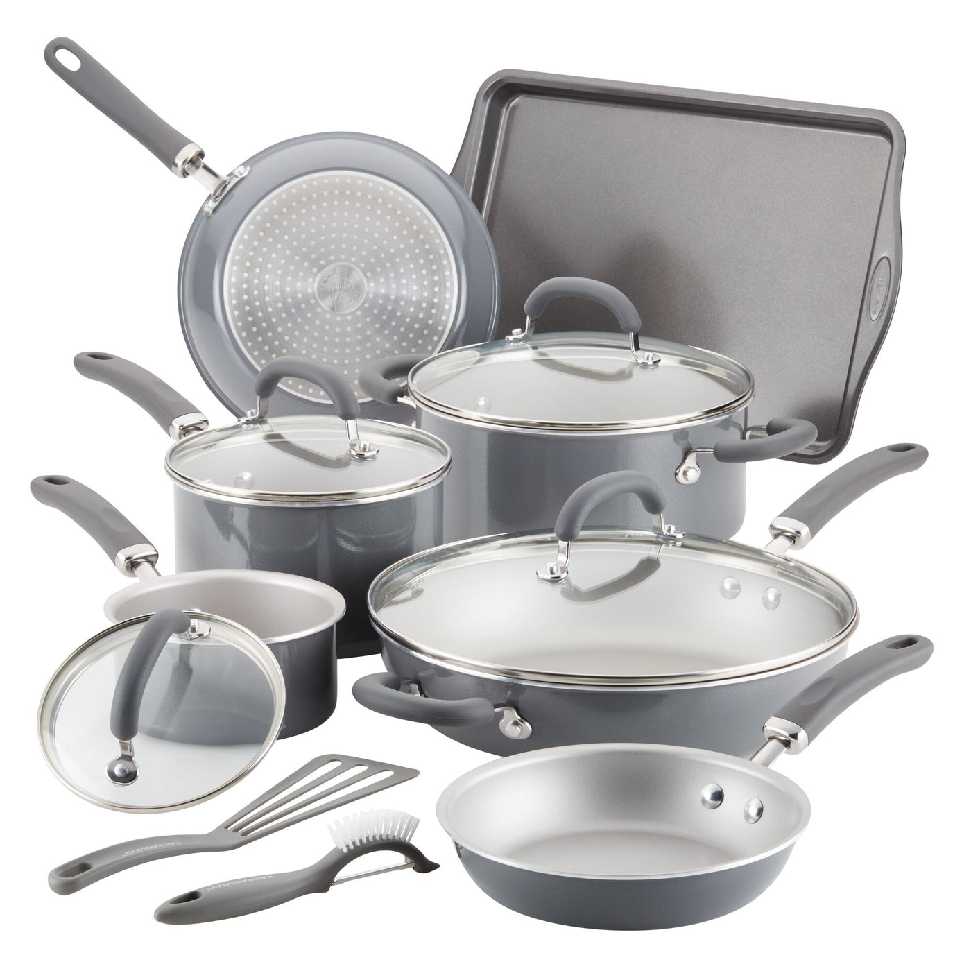 A set of nonstick cookware and utensils with lids on display.