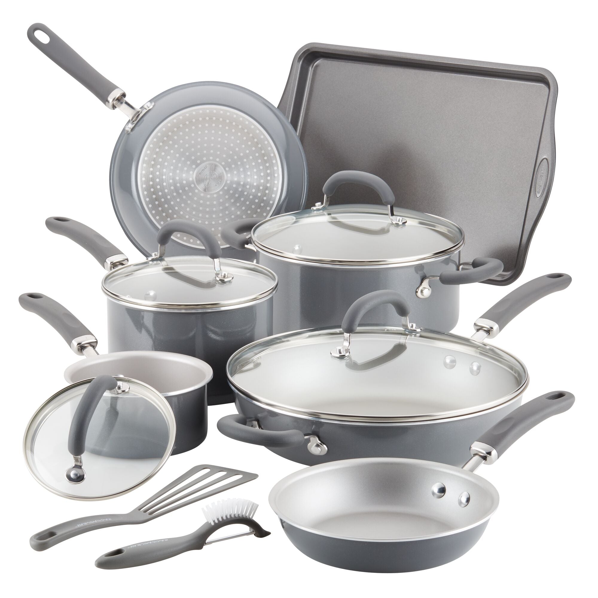 A set of nonstick cookware and utensils with lids on display.