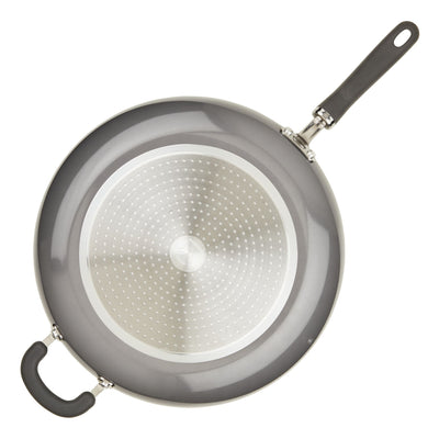Top view of a nonstick frying pan with a black handle and helper handle.