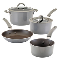 Four pieces of grey cookware, including pots and frying pans.