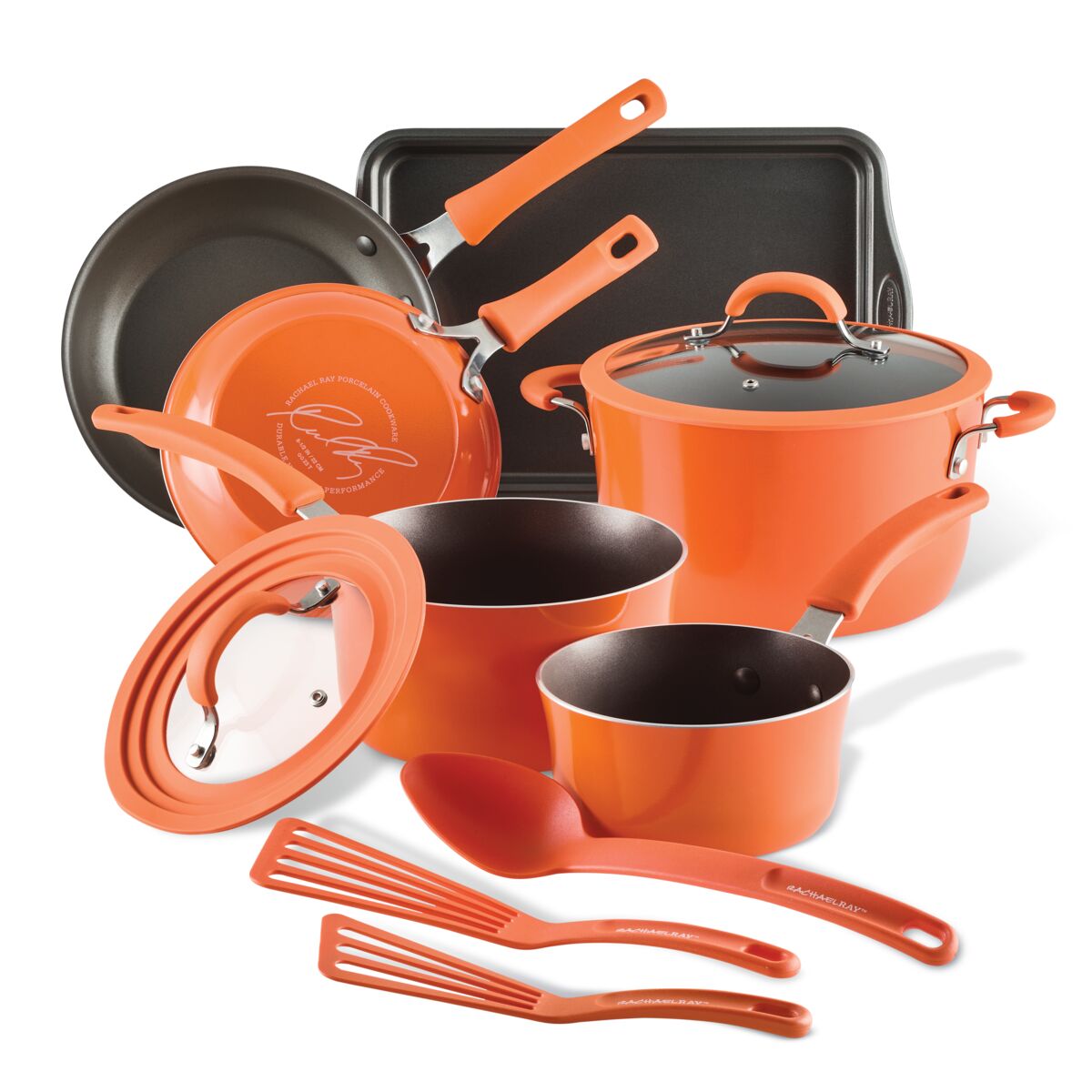 The Cook + Create Nonstick Cookware Sets in a vibrant orange color include pots, pans, and utensils, along with tempered glass lids for easy monitoring. With enhanced scratch resistance, this collection promises lasting durability and performance in your kitchen.