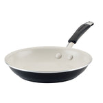 A non-stick frying pan with a black exterior and a cream interior.