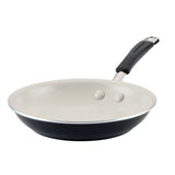 A non-stick frying pan with a black exterior and a cream interior.