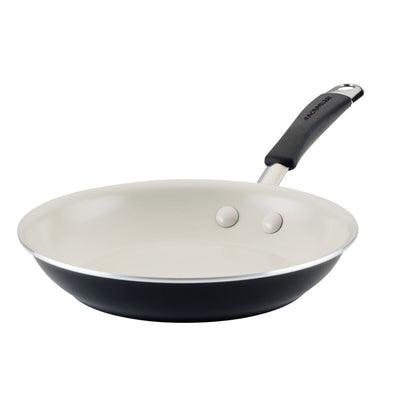 A non-stick frying pan with a black exterior and a cream interior.