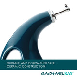 A ceramic oil dispenser with a curved handle and metal spout.