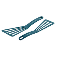 Two teal slotted spatulas with ergonomic handles.