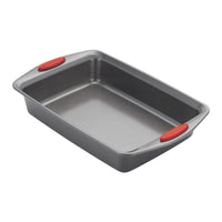 Rectangular baking pan with red silicone grips on the handles.