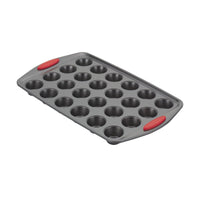 Gray 24-cup mini muffin pan with red silicone grips on handles.