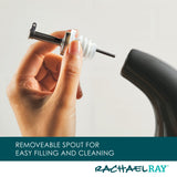 Hand holding a removable spout, designed for easy filling and cleaning.