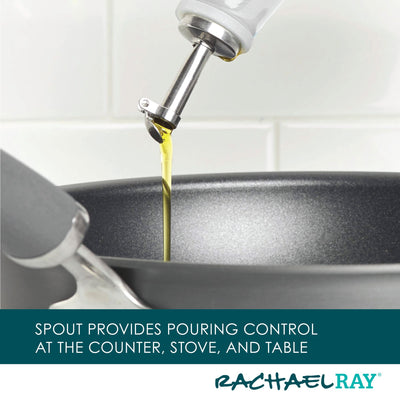 Pouring oil into a black frying pan with a metal handle.