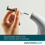 Hand holding a removable spout above a container with Rachael Ray branding.