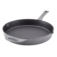 A black cast iron skillet with a handle on a white background.