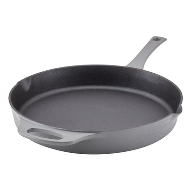 A black cast iron skillet with a handle on a white background.