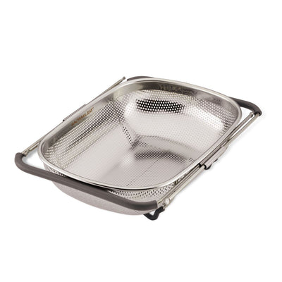 Rectangular metal colander with perforations and foldable handles.