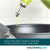 Oil pouring from a green spout into a black pan.