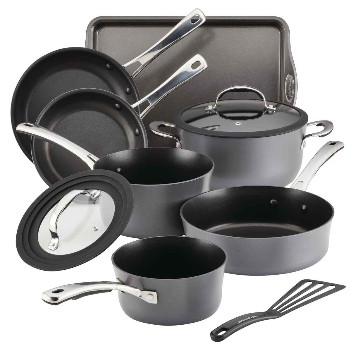 A black nonstick cookware set with pans, pots, lids, a tray, and a spatula.
