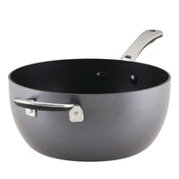 The 4.5-Quart Cook + Create Hard Anodized Nonstick Saucier Pan with Lid and Helper Handle showcases a sophisticated grey non-stick surface paired with a silver handle. Its triple-layer nonstick coating ensures oven safety up to 400°F, offering versatility for any kitchen.