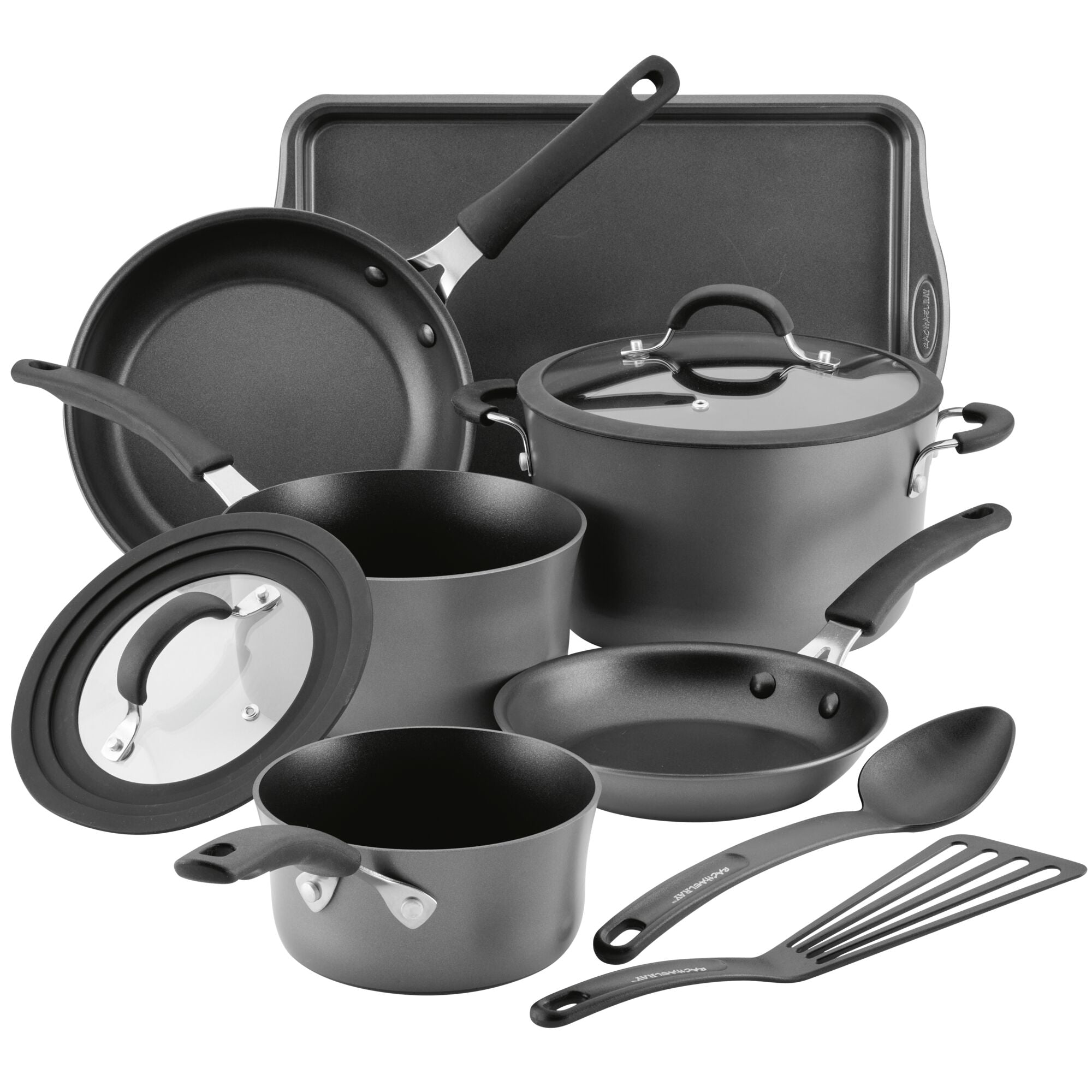 Cookware set with pots, pans, lids, a spatula, and a spoon.