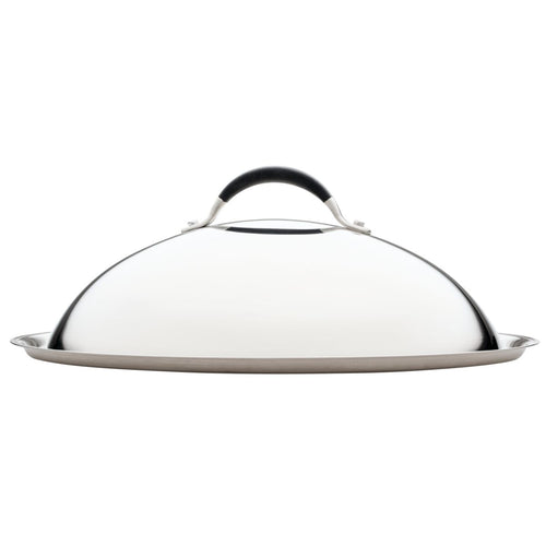 The 14-Inch Stainless Steel Domed Lid, with its stylish silver and black finish and convenient handle, rests elegantly on the flat surface.