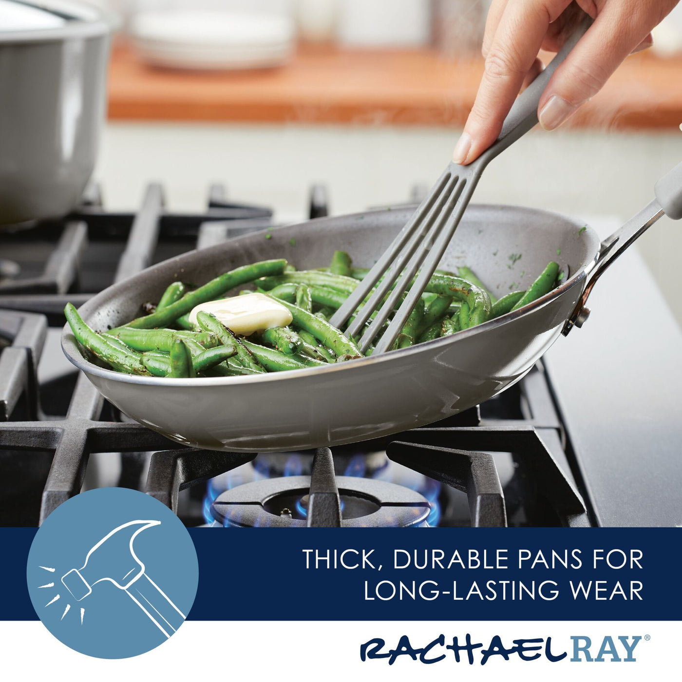 Using the 6-Piece Cook + Create Nonstick Cookware Set, a person skillfully cooks green beans in a nonstick frying pan on a gas stove, appreciating its durable aluminum construction and knowing it's oven safe for versatile use.