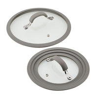 Add a touch of elegance to your kitchen with these glass pot lids featuring gray silicone rims and handles, designed to perfectly complement your 6-Piece Cook + Create Nonstick Cookware Set.