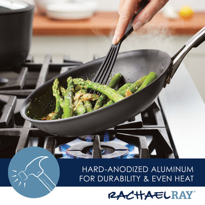 Cooking asparagus in a pan on a gas stove with a spatula.