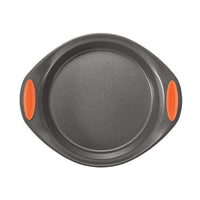 Round baking pan with orange silicone handles, viewed from above.